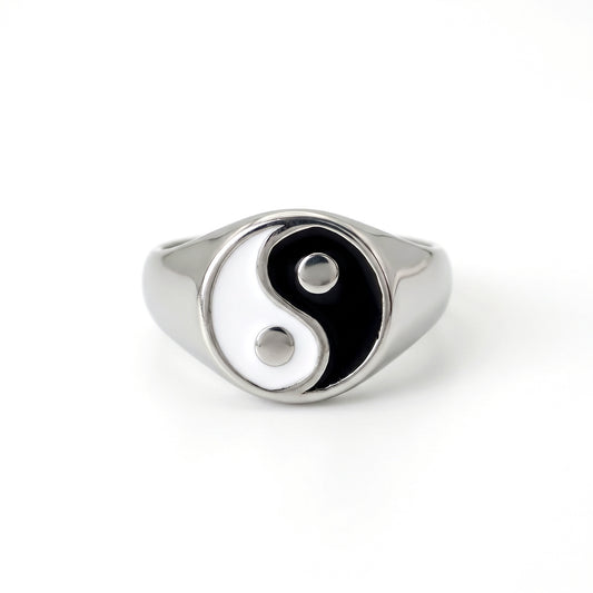 Eclipse yin-yang signet ring in stainless steel, front view on white background
