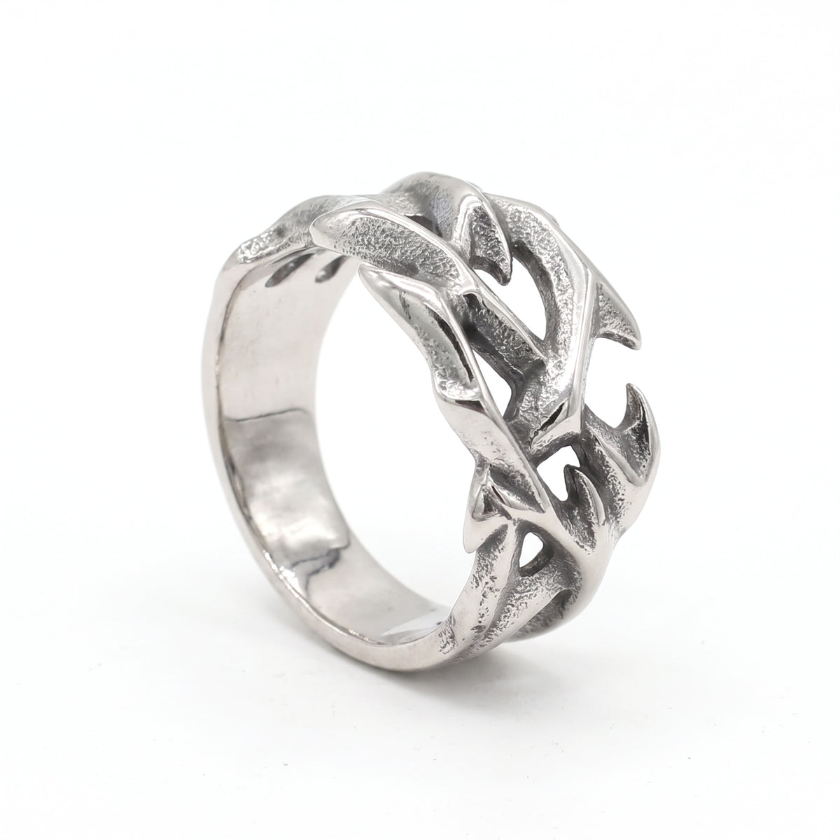 Penance crown of thorns ring in stainless steel, three-quarter view showing the thorned branches on white background
