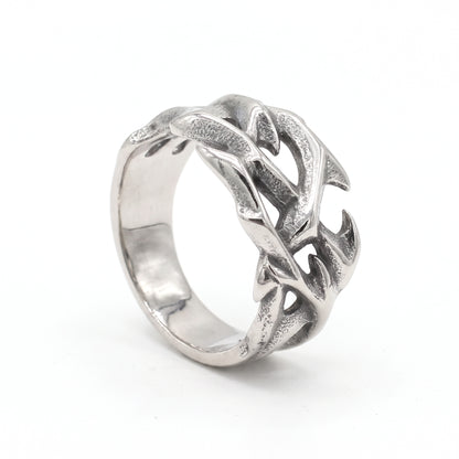 Penance crown of thorns ring in stainless steel, three-quarter view showing the thorned branches on white background