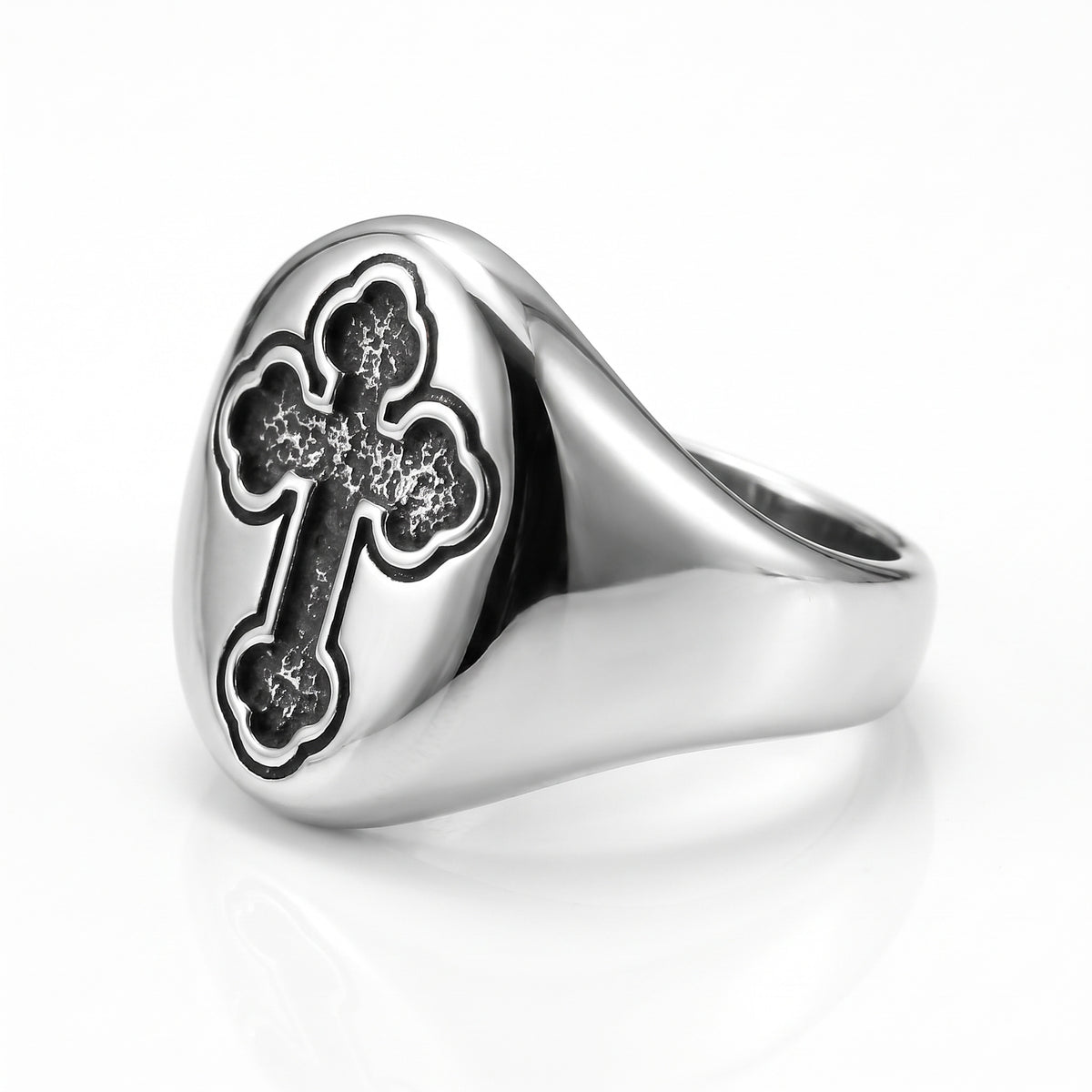 Reliquary Cross Amulet Ring, three-quarter side view showing the wide tapered shoulders and smooth band, on white background