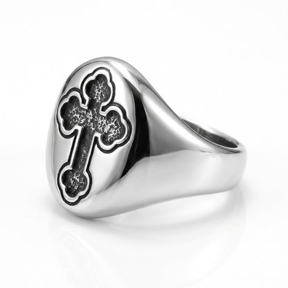 Reliquary Cross Amulet Ring, three-quarter side view showing the wide tapered shoulders and smooth band, on white background