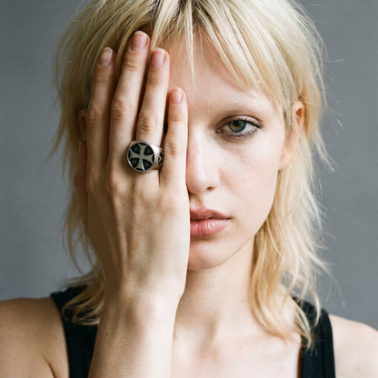 Blonde model with her hand over half her face wearing the Seneschal Templar cross signet ring