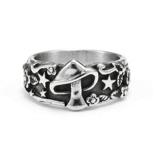 Spore mushroom and stars stainless steel ring, front view on white background