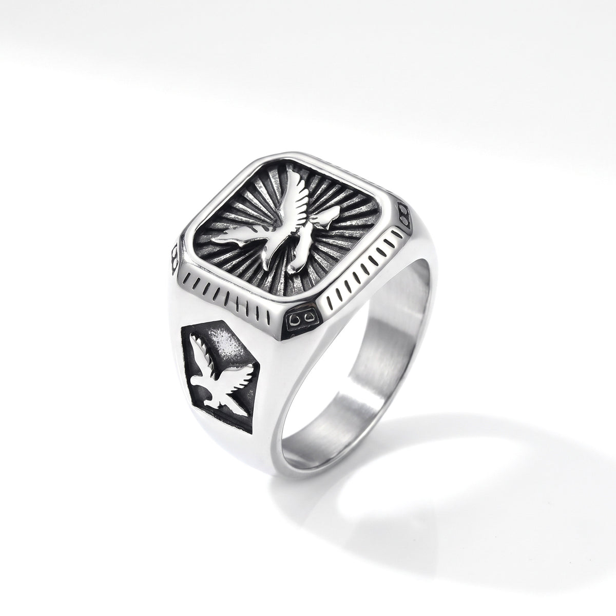 Talon winged eagle signet ring in stainless steel, front view on white background