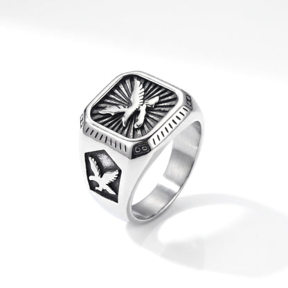 Talon winged eagle signet ring in stainless steel, front view on white background