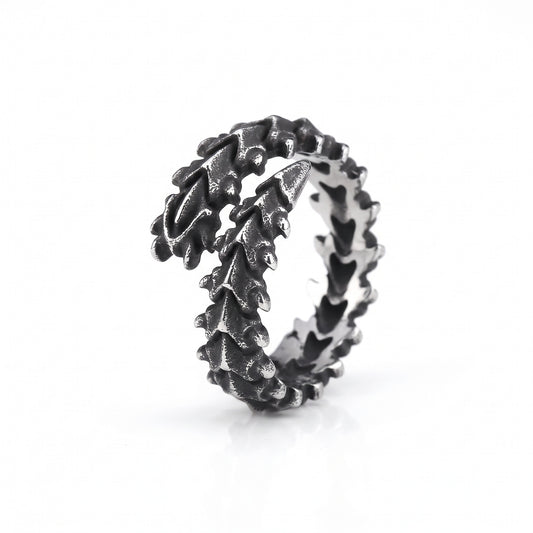 Vertebra dragon bone wrap ring in stainless steel, front view on white background