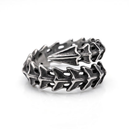 Vertebra dragon bone wrap ring in stainless steel, angled view from above on white background